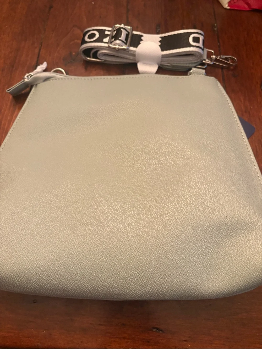 Izod Light Gray Pebbled Crossbody Bag with Branded Strap